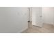 Clean hallway with tile flooring and door at 7280 E White Tail Rd, San Tan Valley, AZ 85143