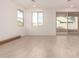 Bright living room with tile floors and sliding glass door leading to backyard at 7280 E White Tail Rd, San Tan Valley, AZ 85143