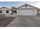 House exterior featuring a two-car garage and well-maintained landscaping at 14161 W White Rock Dr, Sun City West, AZ 85375