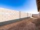 View of block wall in the backyard provides privacy and security at 16032 W Desert Hollow Dr, Surprise, AZ 85387