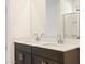Bathroom double vanity sinks with modern fixtures at 16032 W Desert Hollow Dr, Surprise, AZ 85387
