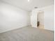Clean bedroom provides a calm space and has an en-suite bathroom at 16032 W Desert Hollow Dr, Surprise, AZ 85387