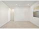 A bright bedroom features lots of natural light and neutral tile flooring at 16032 W Desert Hollow Dr, Surprise, AZ 85387