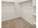 Walk-in closet with shelving offering ample storage space at 16032 W Desert Hollow Dr, Surprise, AZ 85387