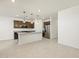 Bright kitchen with granite countertops, stainless steel appliances, and island with pendant lighting at 16032 W Desert Hollow Dr, Surprise, AZ 85387