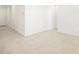 A bright living area offers ample space and neutral tile flooring at 16032 W Desert Hollow Dr, Surprise, AZ 85387