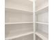 Walk in pantry featuring white shelving to maximize storage at 16032 W Desert Hollow Dr, Surprise, AZ 85387