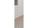 Clean white baseboard and wood-look tile flooring against a white wall at 16066 W Prickly Pear Trl, Surprise, AZ 85387