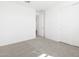Bright bedroom featuring plush carpeting, a spacious closet, and an open doorway at 16066 W Prickly Pear Trl, Surprise, AZ 85387