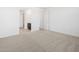 Spacious bedroom with neutral carpet and view to the ensuite bathroom at 16066 W Prickly Pear Trl, Surprise, AZ 85387
