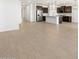 View of living room leading to the kitchen, showcasing the open-concept design at 16066 W Prickly Pear Trl, Surprise, AZ 85387
