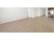 Spacious living room with light wood-look tile flooring and neutral walls at 16066 W Prickly Pear Trl, Surprise, AZ 85387