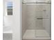 Clean bathroom shower with clear glass door and tiled walls at 16066 W Prickly Pear Trl, Surprise, AZ 85387