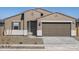 Charming single-story home featuring a neutral color palette, a two-car garage, and low-maintenance landscaping at 16072 W Prickly Pear Trl, Surprise, AZ 85387