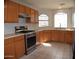Spacious kitchen with stainless steel appliances and wood cabinets at 17134 N Eureka Trl, Surprise, AZ 85374