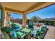 Relaxing patio furniture with a view of the pool and landscaped backyard at 17939 W Lavender Ln, Goodyear, AZ 85338