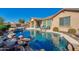 Beautiful pool and spa surrounded by a lush landscape at 17939 W Lavender Ln, Goodyear, AZ 85338