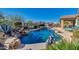 Inviting kidney-shaped pool with a waterfall feature and spa at 17939 W Lavender Ln, Goodyear, AZ 85338