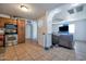 Kitchen with wood cabinets and view into living room at 1931 N Macdonald --, Mesa, AZ 85201