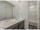 Bathroom with double sinks, modern fixtures, and a view to a separate toilet and shower area at 3247 W Garnet St, San Tan Valley, AZ 85144
