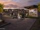 Community space featuring a fire pit with patio seating, set against a backdrop of neighborhood homes at 3247 W Garnet St, San Tan Valley, AZ 85144