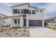 Contemporary two-story home featuring a gray garage door and neutral-colored stucco facade at 3247 W Garnet St, San Tan Valley, AZ 85144