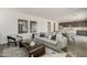 Comfortable living room with stylish decor, neutral tones, and an open layout to the dining area at 3247 W Garnet St, San Tan Valley, AZ 85144