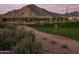 Walking path through the community park, featuring mountain views, disc golf, and playground area at 3247 W Garnet St, San Tan Valley, AZ 85144