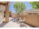 Private backyard area features comfortable seating and shade for relaxing outdoors at 4202 E Broadway Rd # 132, Mesa, AZ 85206