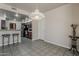 Airy dining room with a pendant light fixture and easy access to the kitchen at 4202 E Broadway Rd # 132, Mesa, AZ 85206