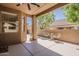 Inviting outdoor patio with shade, privacy walls, and comfortable seating at 4202 E Broadway Rd # 132, Mesa, AZ 85206