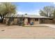 Charming home featuring desert landscaping, covered parking, and a cozy front patio area at 517 W 17Th St, Tempe, AZ 85281