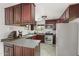 Well-equipped kitchen featuring stainless steel appliances, dark cabinets, and ample counter space at 517 W 17Th St, Tempe, AZ 85281