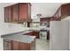 Well-equipped kitchen with stainless steel appliances and dark wood cabinets at 517 W 17Th St, Tempe, AZ 85281