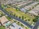 Aerial view of community with homes and large green space at 10605 E Monterey Ave, Mesa, AZ 85209