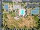 Overview of community amenities including pool, tennis courts, and playground at 10605 E Monterey Ave, Mesa, AZ 85209