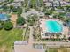 Aerial view of community pool, clubhouse, and surrounding landscape at 10605 E Monterey Ave, Mesa, AZ 85209