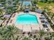 Large community pool with plenty of lounge chairs and shade structures at 10605 E Monterey Ave, Mesa, AZ 85209