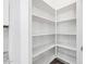 Walk-in pantry with ample shelving for storage at 10605 E Monterey Ave, Mesa, AZ 85209