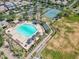 Community pool and tennis courts with surrounding green space at 10605 E Monterey Ave, Mesa, AZ 85209