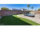 Spacious backyard with artificial turf and a relaxing pool area at 14953 W Cortez St, Surprise, AZ 85379