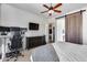 Bedroom with a barn door, workspace, and view of the kitchen at 14953 W Cortez St, Surprise, AZ 85379