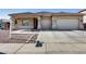 One-story house with a two-car garage and desert landscaping at 14953 W Cortez St, Surprise, AZ 85379