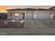 House exterior with two-car garage and landscaping at 14953 W Cortez St, Surprise, AZ 85379