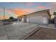 Two-car garage and well-maintained front yard at 14953 W Cortez St, Surprise, AZ 85379