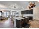 Open concept kitchen with island and view into Gathering room at 14953 W Cortez St, Surprise, AZ 85379