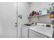 Laundry room with washer, dryer, and shelving at 14953 W Cortez St, Surprise, AZ 85379