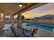 Scenic view of the pool and patio at sunset at 14953 W Cortez St, Surprise, AZ 85379