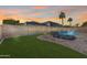 Lush green lawn and inviting pool area at 14953 W Cortez St, Surprise, AZ 85379