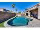 Stunning kidney-shaped pool with a flagstone patio and lush lawn at 14953 W Cortez St, Surprise, AZ 85379